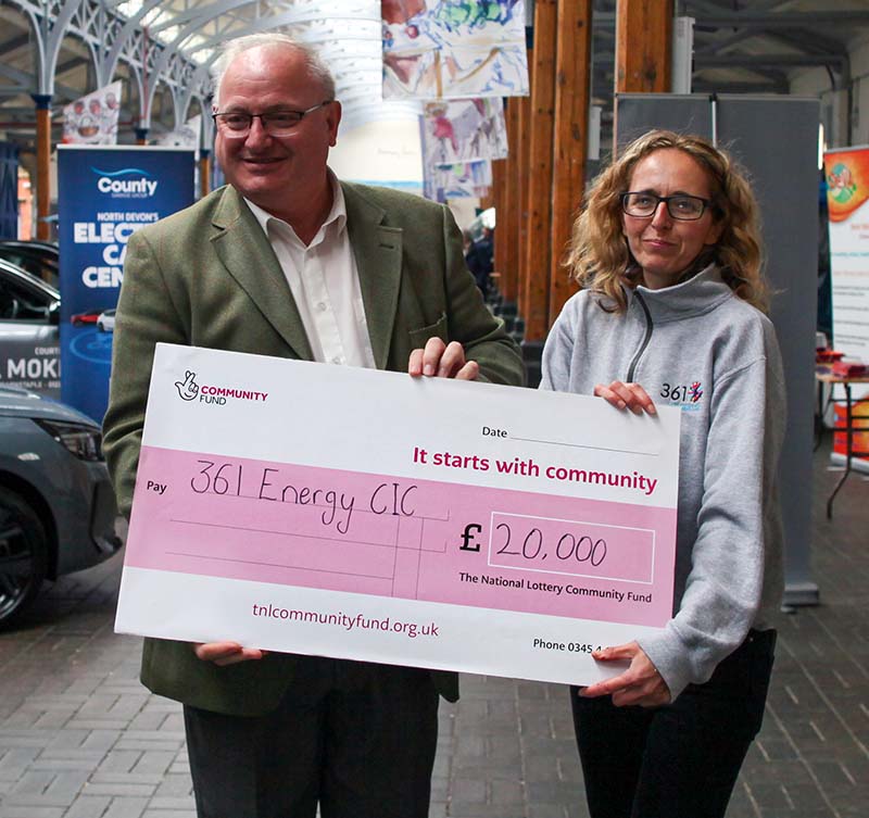 Ian Roome MP presents National Lottery cheque to Jenny Challenger, Programme Manager for 361 Energy CIC